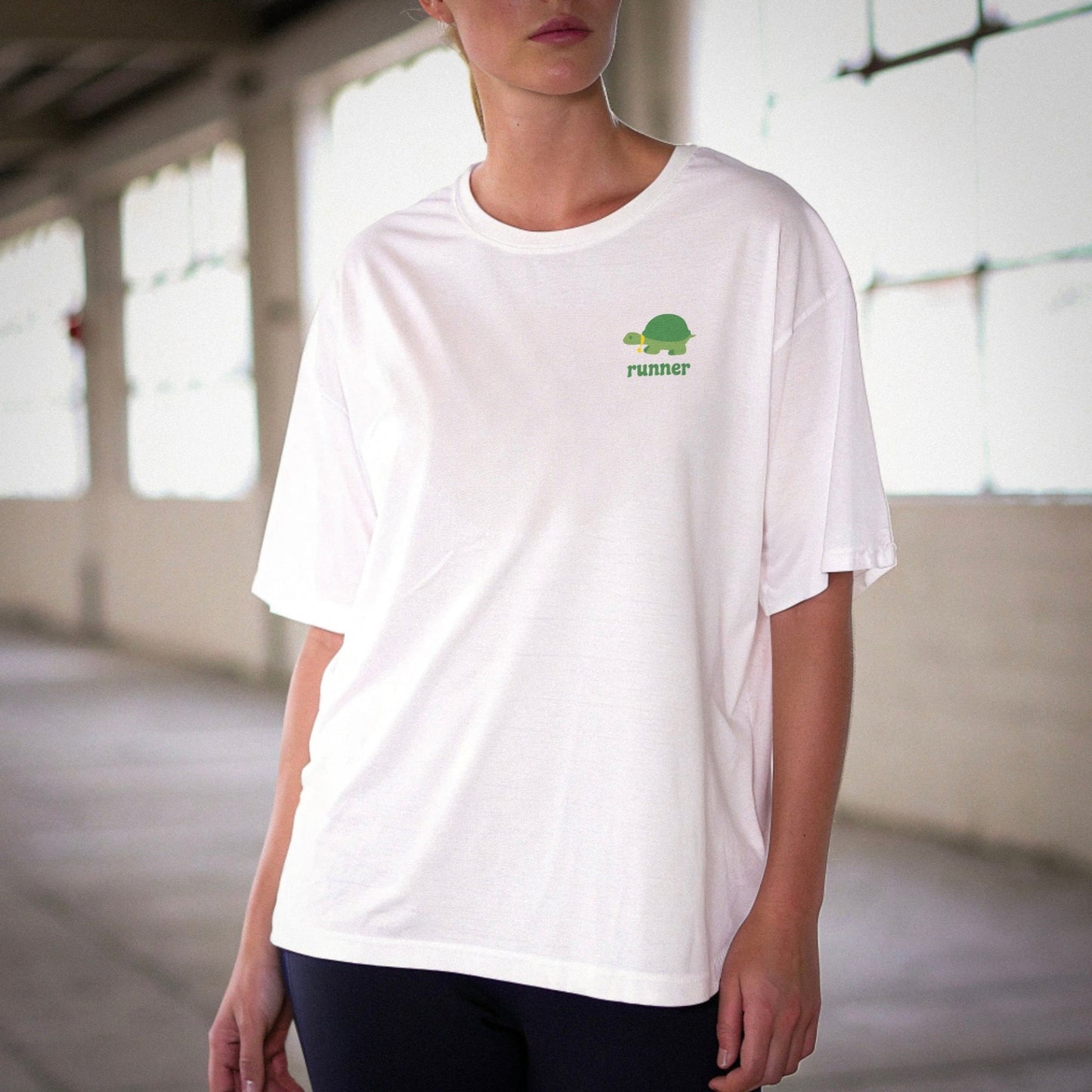 Slow_runner_oversized_white_t-shirt_with_green_turtle