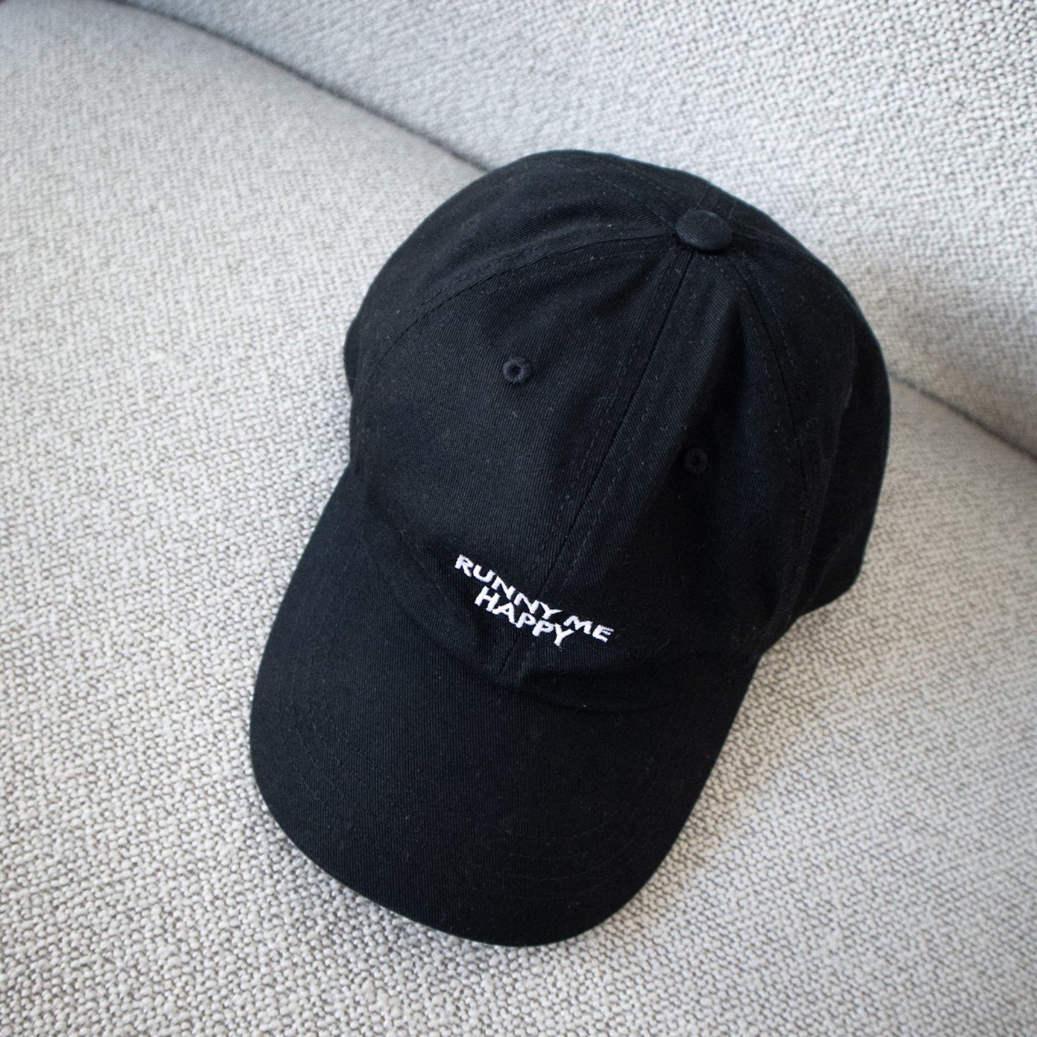 Black cap with white text for runners