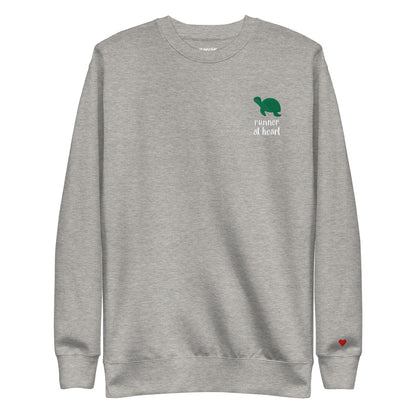 Gray sweatshirt with a green turtle graphic and text runner at heart
