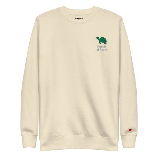 Beige sweatshirt with a green turtle graphic and text runner at heart